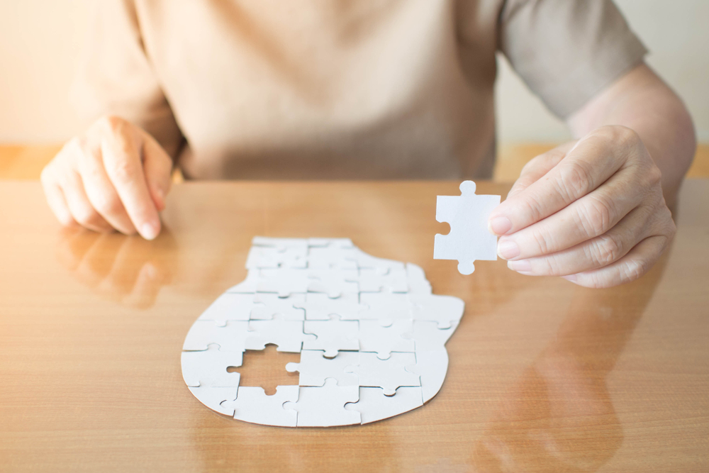 Elderly,Woman,Hands,Holding,Missing,White,Jigsaw,Puzzle,Piece,Down