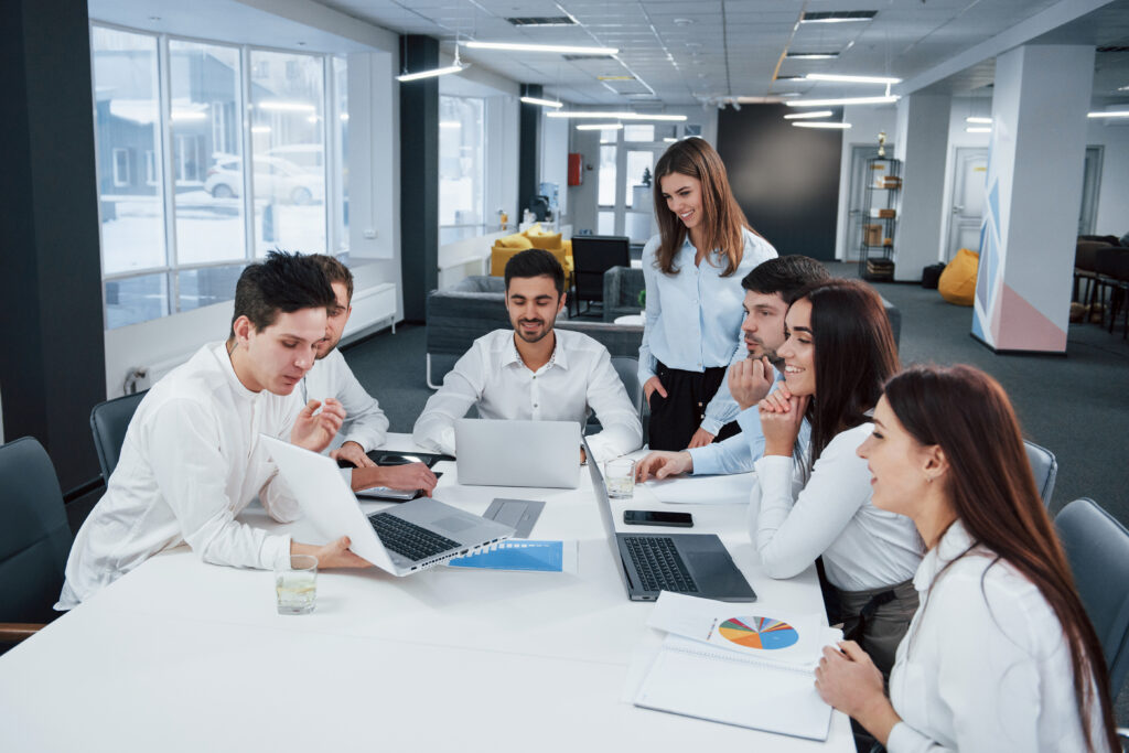 showing good results group young freelancers office have conversation smiling